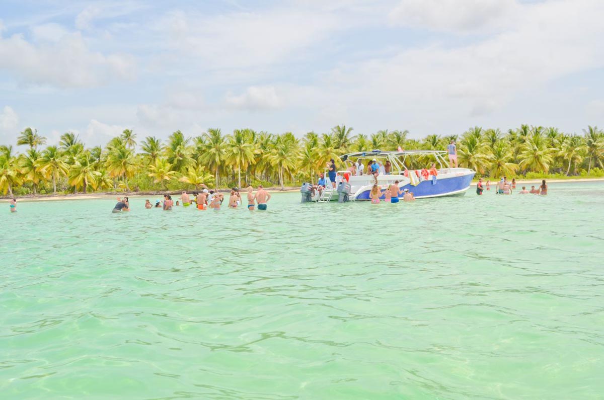 Tourists disembarking in the pristine waters at Saona Beach