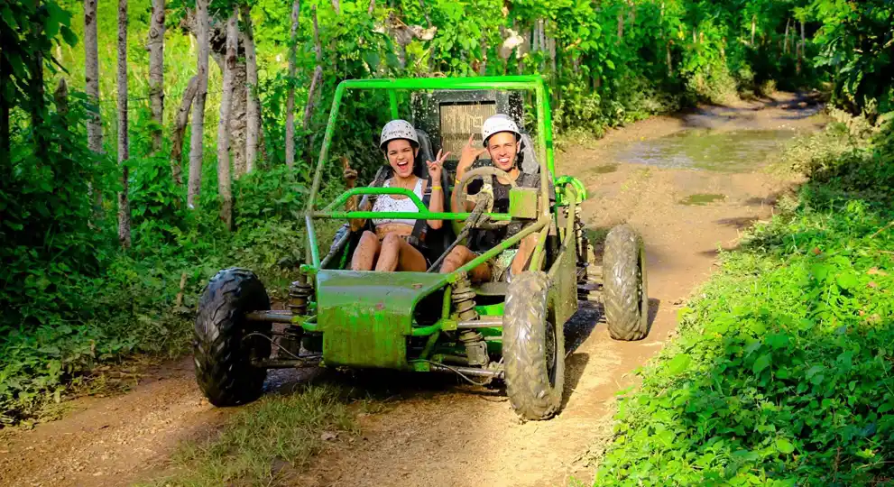 Couple driving a buggie through the farm roads