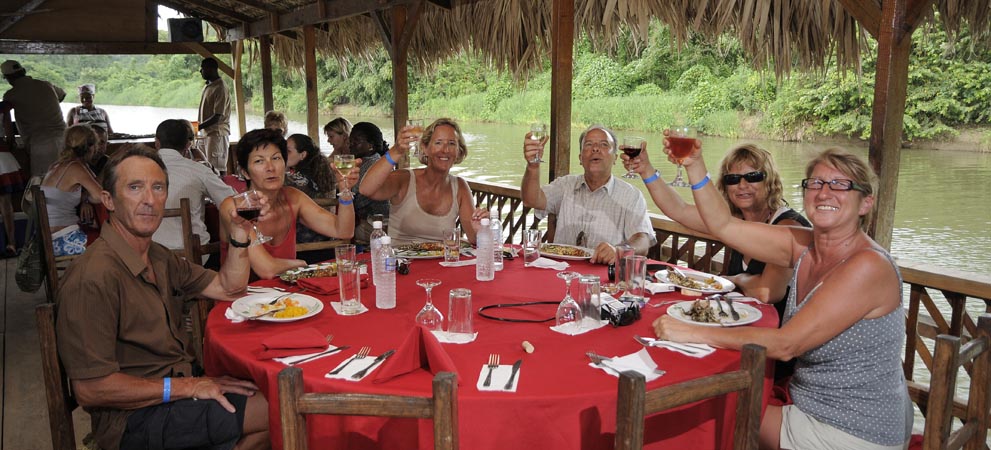 Tourists enjoying the langosta lunch during the river tour