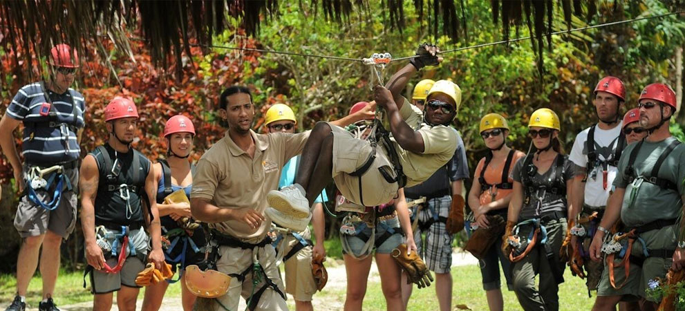 staff-demonstrating zip line gear use