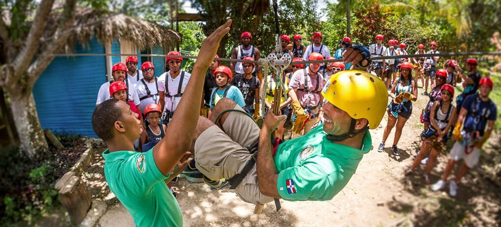 staff-demonstrating zip line gear use