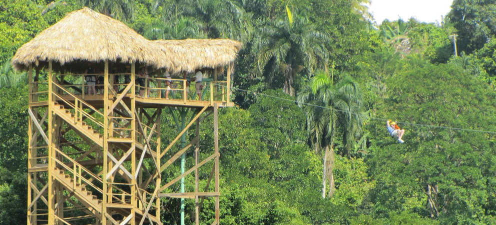 tourist enjoying the zip line ride through the dominican mountains